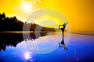 Yoga natarajasana on the beach