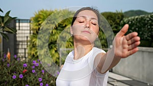 Yoga in the open air. Close-up of a woman in a warrior pose