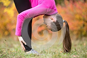 Yoga outdoors: Standing forward bend pose