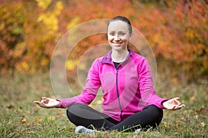 Yoga outdoors: yogi girl meditating