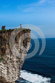 Yoga pose at Karang Boma Cliff, Edge of Bali