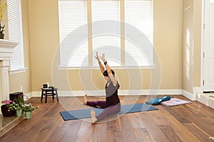 Yoga Pose Upavista Konasana seated indoors