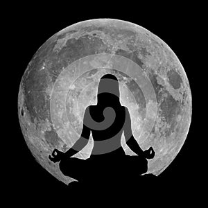 Yoga position silhouette against the Moon