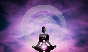 Yoga position silhouette in contrasting sun, Crown chakra