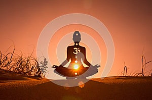 Yoga position silhouette in contrasting sun, Sacral chakra