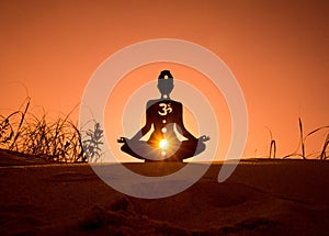 Yoga position silhouette in contrasting sun, Sacral chakra