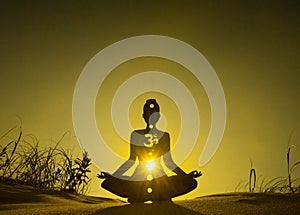 Yoga position silhouette in contrasting sun, Solar Plexus chakra