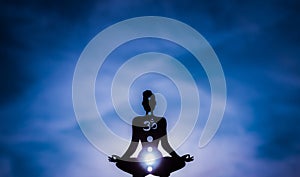 Yoga position silhouette in contrasting sun, Third Eye chakra