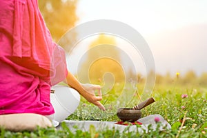 Yoga position with Tibetan bell