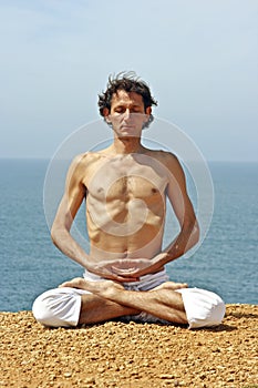Yoga posture on the rocks