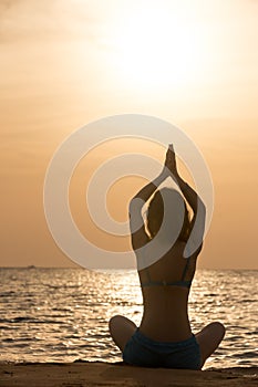 Yoga practice at sea shore