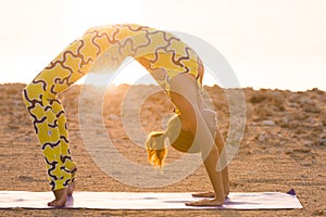 Yoga practice. Woman doing bridge pose