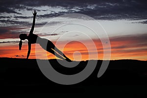 Yoga practicioner during sunset