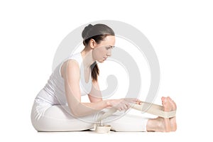 Yoga with props, seated forward bend pose