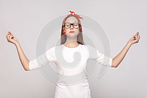 Yoga relaxed raised hands portrait of beautiful emotional young