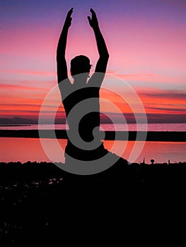 Yoga silhouette at sunset reflecting inner peace