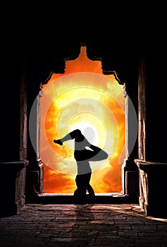 Yoga silhouette in temple