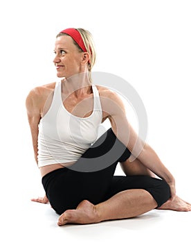 Yoga spine twisting pose fitness trainer photo