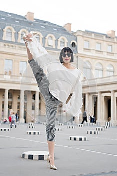 Yoga and sport concept. Sensual woman with brunette hair. Woman pose on high heel shoes in paris, france. Beauty girl