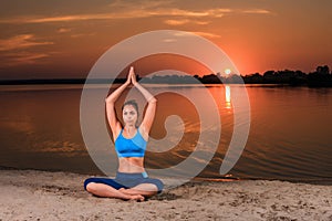 Yoga at sunset on the beach.