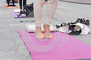 Yoga teachers protesting the Covid-19 blockade and restrictions. Female feet on the fitness mat
