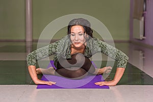 Yoga trainee doing yoga stretches