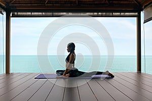 Yoga Training. Woman In Sport Clothes Stretching Body Near Sea