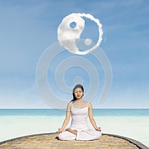 Yoga under Yin Yang cloud photo