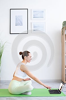 yoga video lesson morning meditation woman laptop