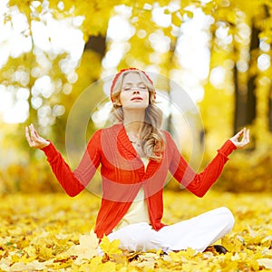 Yoga woman in autumn park