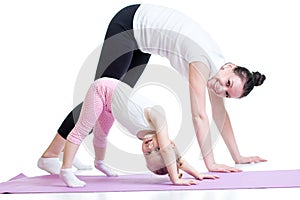 Yoga for woman and child. Mother and kid do