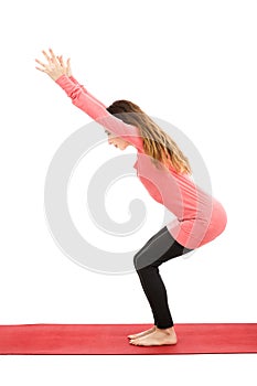 Yoga woman doing chair pose