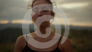 Yoga woman meditating in mountains. Young lady practicing yoga outdoor