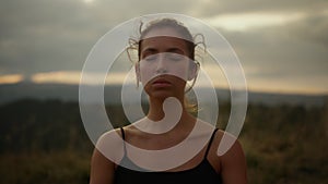 Yoga woman meditating in mountains. Young lady practicing yoga outdoor