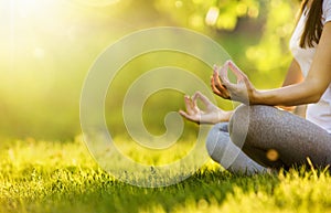 Yoga woman meditating at sunset