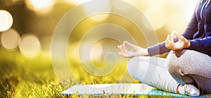 Yoga woman meditating at sunset