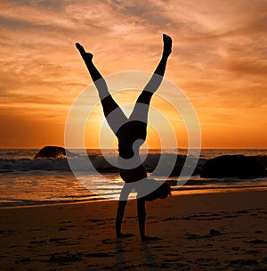 Yoga woman, silhouette or handstand on sunset beach, sea or ocean in workout or relax exercise training. Yogi, pilates