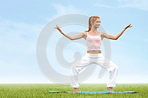 Yoga Woman. Young woman practicing morning meditation against na