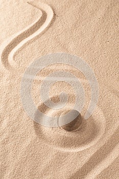 Yoga or zen Buddhism stone and sand background