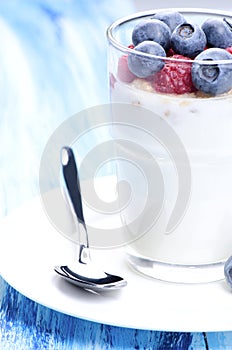 Yoghurt dessert and sppon photo