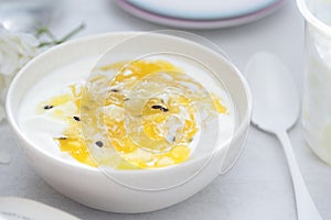 Yoghurt with mango and passion fruit compote