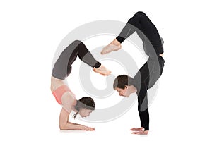 Yogi couple in yoga Scorpion Pose