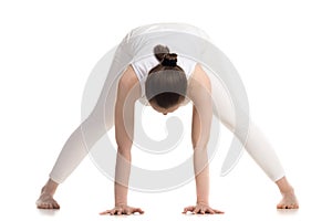 Yogi female doing Prasarita Padottanasana pose photo