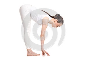 Yogi female standing in Uttanasana pose