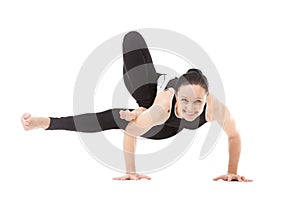 Yogi female in yoga asana Parivritta Eka Pada Koundinyasana