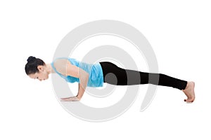 Yogi female in yoga pose Chaturanga Dandasana