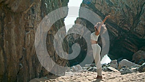 Yogi girl standing feet after headstanding outdoors. Woman practicing yoga.