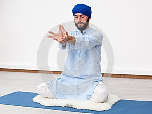 Yogi man sitting in meditation photo