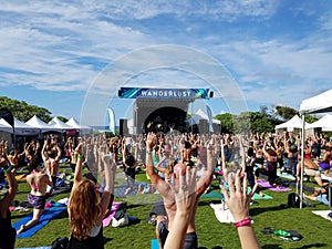 Yogi move arms in Farewell: blissed and blessed yoga class