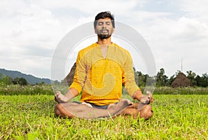 Yogi sitting in lotus pose